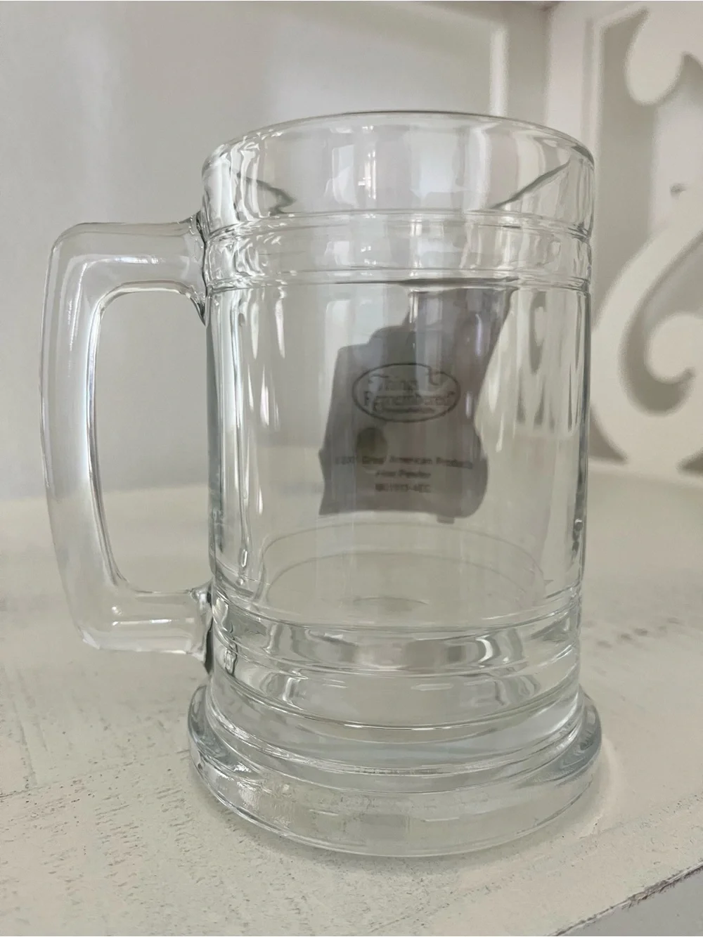 Glass beer stein with an applied pewter American flag emblem